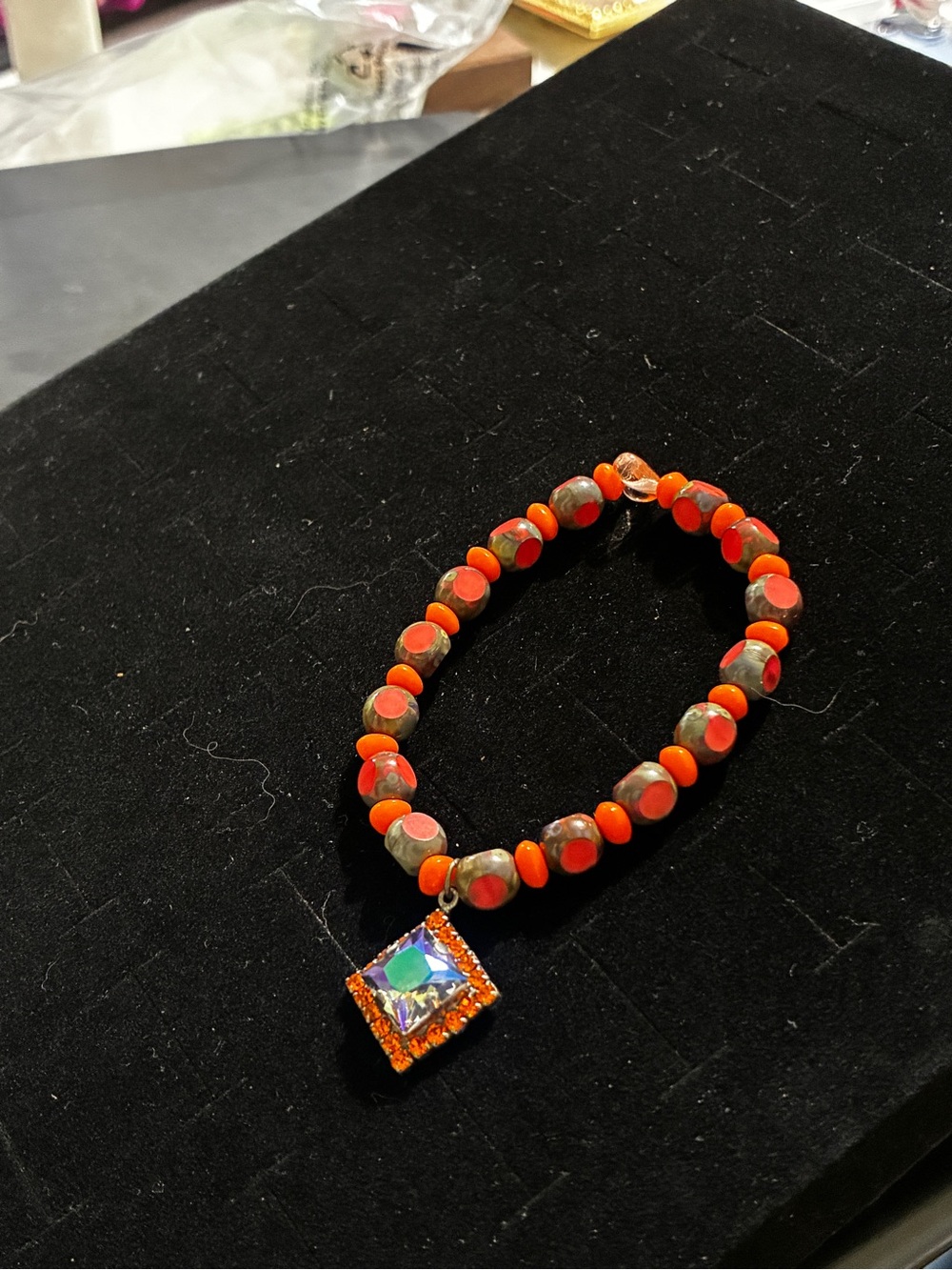 Sabika’s Orange Beaded Stretch Bracelet with Swarovski Crystal Square Charm.